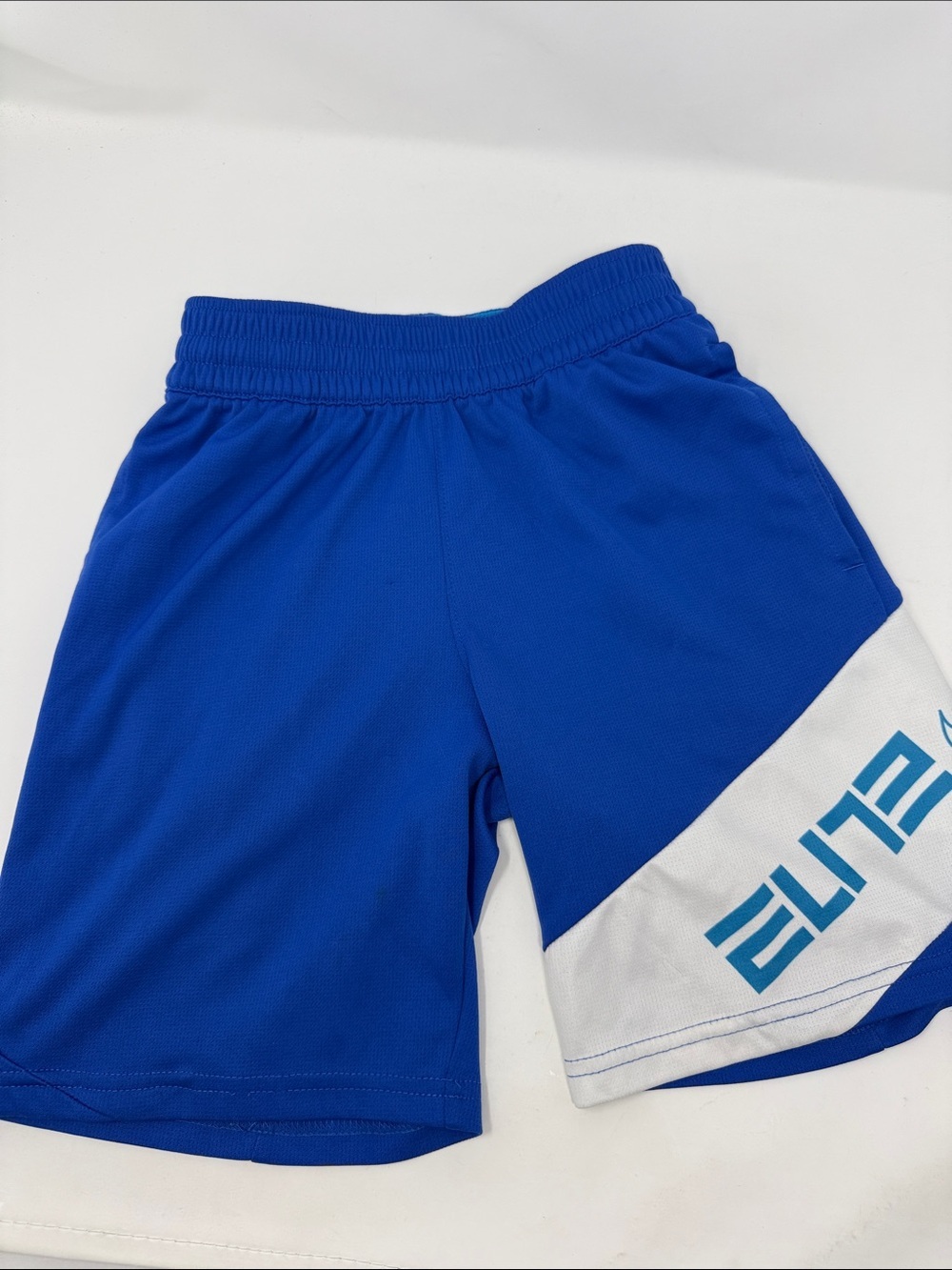 Kid’s Nike Blue Athletic Shorts with White Accent and 'ELITE' Graphic Size Small